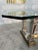 The Mid-Century Modern Sculpted Metal and Marble Dining Table from the 1970s is an elegant piece of furniture known for...