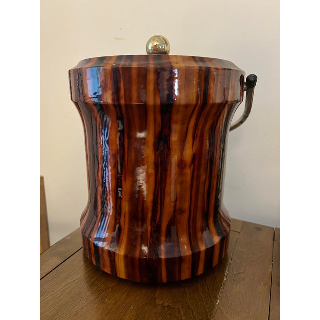 Mid 20th Century. High gloss Tortoise / Tiger Eye design. Brass handle. Perfect addition for your bar! Thank you for...