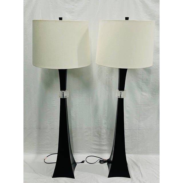 The floor lamp is a copper repousse with black copper base and oyster linen Shade. Retail price is $5195 a piece and can...