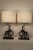 Unusual pair of Gusttave Kaitz Art Deco table lamps. Each lamp is a bronze finish gazelle mounted on onyx bases. Beautiful...