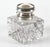 A heavy, square-bodied crystal inkwell with swirled, spiral-fluted sides that give it a twisting, rippled look with a...