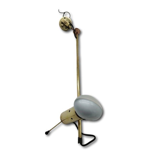 The Model 194 wall lamp is a rare piece by Tito Agnoli for Oluce, Italy 1954. It is a first edition, with arms and...