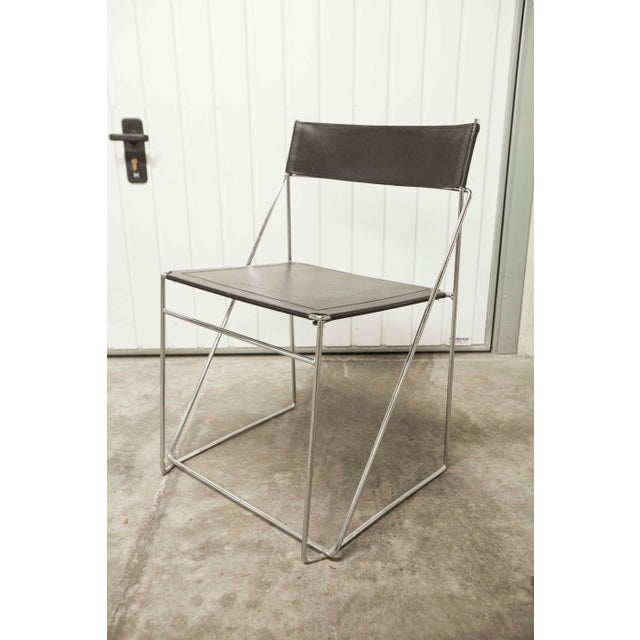 Immerse yourself in the timeless elegance of Scandinavian design with this X Line chair, designed by renowned designer...