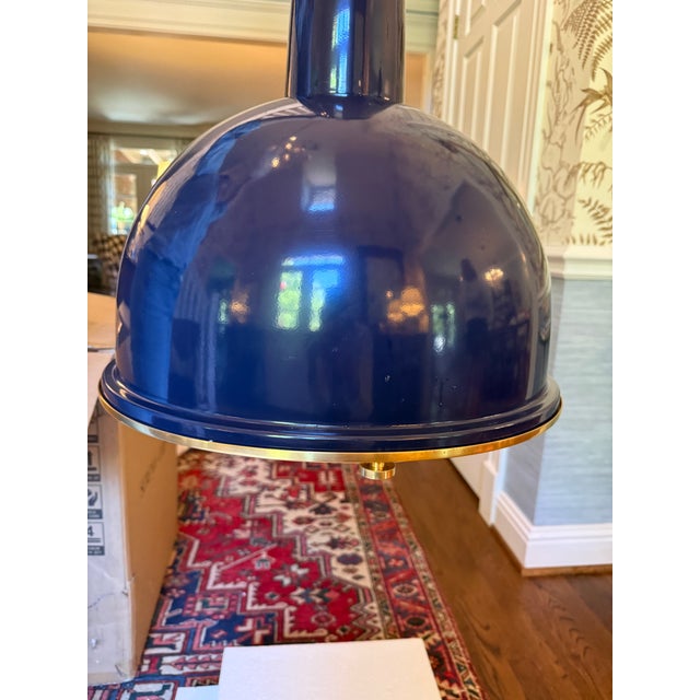 NEW IN BOX! Melrose Pendant Light in navy blue aluminum with a glass diffuser. Fixture is trimmed in warm brass and...
