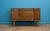 Compact mid century sideboard by Uniflex with striped walnut veneer, chevron drawer detail and tapered legs. Originally...