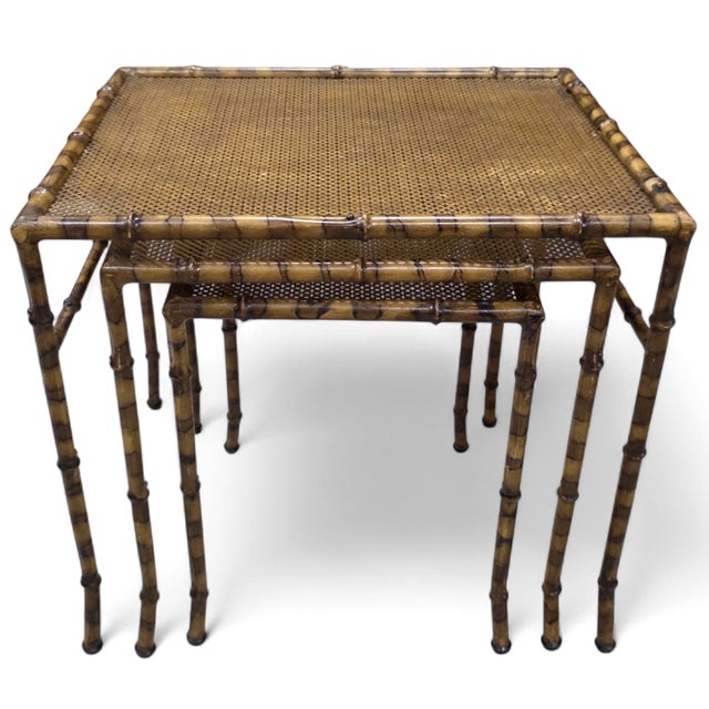 This Vintage Hollywood Regency Faux Tortoiseshell, Faux Bamboo & Faux Cane Metal Nesting Tables — Set of Three constructed...