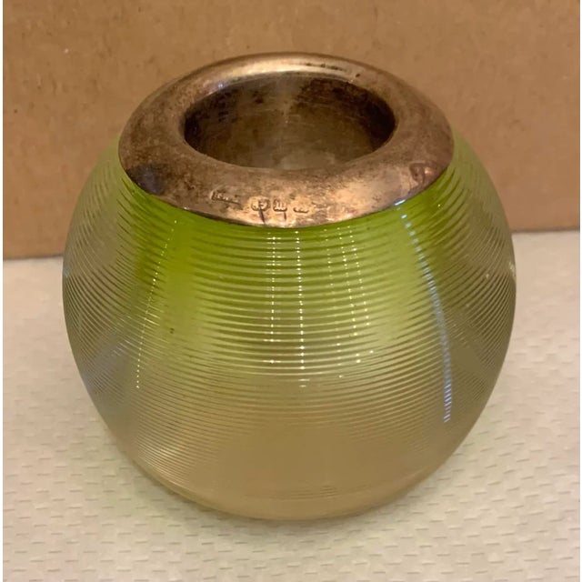 1950s glass match striker with ribbed green tinted glass and silver rimmed top. Stamped and signed.
