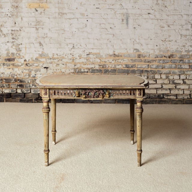 Add refined French elegance to your space with this 19th century French light wood base and marble top table, a...