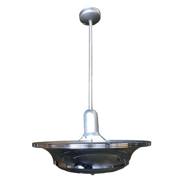Two two-layer chromed steel Art Deco Streamline saucer ceiling pendant lamp featuring a round layered design. The light is...