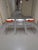 Set of three bar stools of technopolymer shell with high gloss white seat - 2 with transparent orange back and one with...