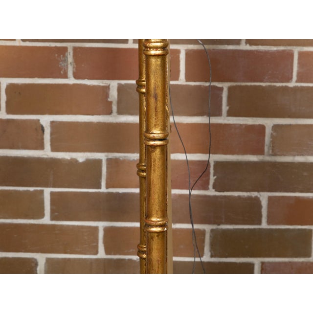 This Midcentury exquisite Italian gilt faux bamboo mirror from circa 1950 exudes a timeless elegance and refined...