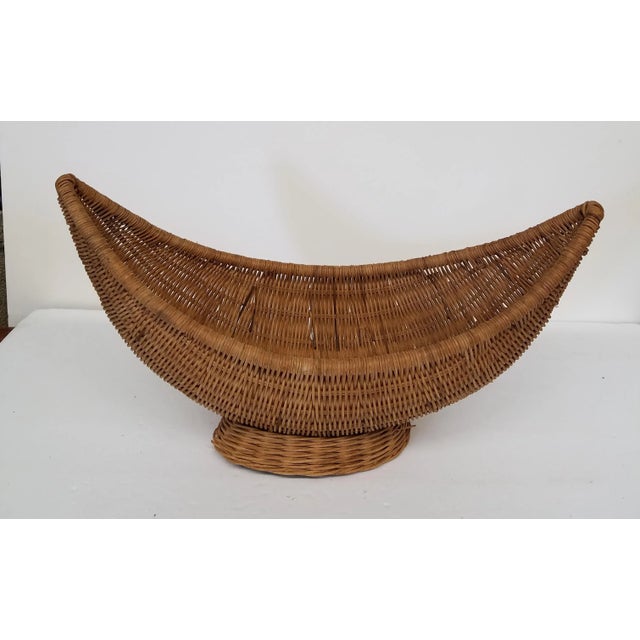 Wonderfully fun mid Century Modern stylish shaped Natural wicker basket or Centerpiece. . Excellent condition and quality.