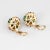 Elegant pair of gemstone cluster earrings crafted in 18k yellow gold. Round brilliant cut diamonds total an estimated 2.70...
