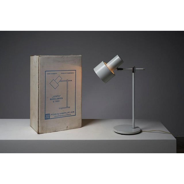 Discover a piece of danish design history with this "lento" table lamp (model e 7183), designed by jo hammerborg for fog &...