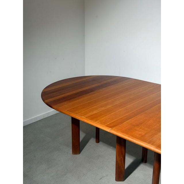 Impressive extendable dining table by Hédem Team , designed and manufactured in Belgium during the 1980s. This substantial...
