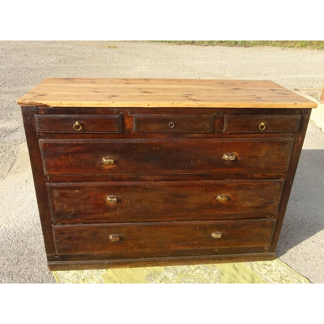 19th-century counter unit with a 2.7 cm thick pine top. It features three small drawers and three very large drawers, all...