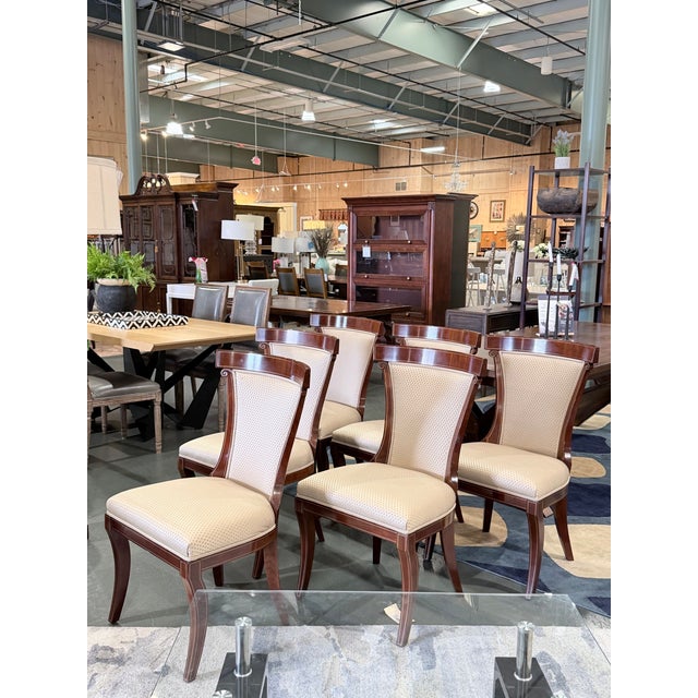 A distinguished set of six John Widdicomb dining chairs showcasing the timeless sophistication of Neoclassical design....