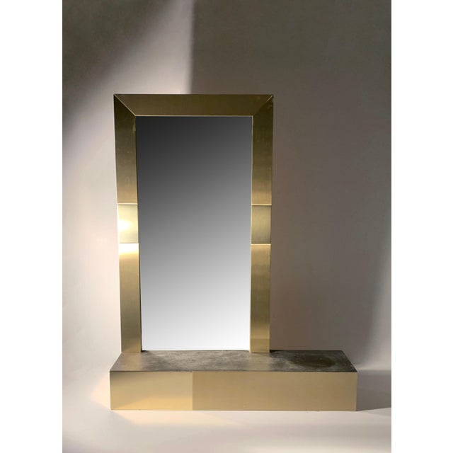 A vintage 1980s Brass Console Mirror with Faux Slate Top attributed to Paul Evans for Directional in the 80s. Some vintage...