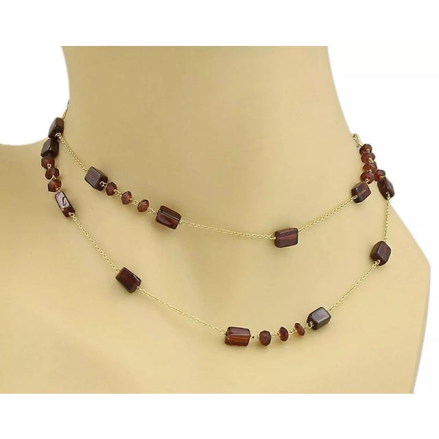 This is a beautiful long chain necklace, it is crafted from solid 18k yellow gold in a fine polished finish. The fine...