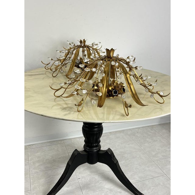 Set of 2 large Mid-Century ceiling lights attributed to Maison Baguès in crystal and iron. 8 lights each, intact and...