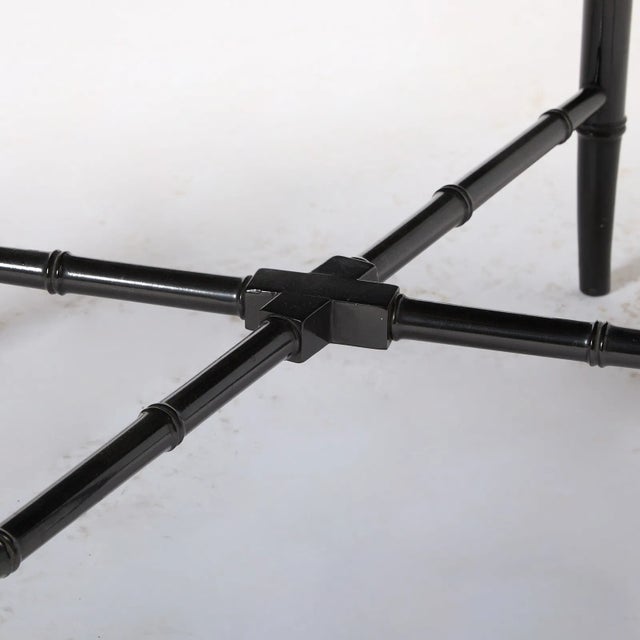 Antique gilt decorated black painted oval papier mache removable tray, circa 1880 on a later stand. Some wear to the...