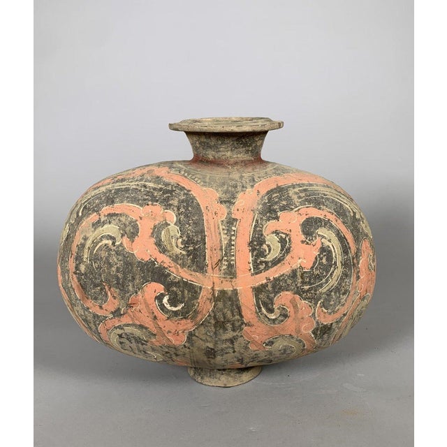 Cocoon vase in polychrome terracotta, Early Han Dynasty (206 BC - 220 AD). Polychrome painted terracotta with archaic...