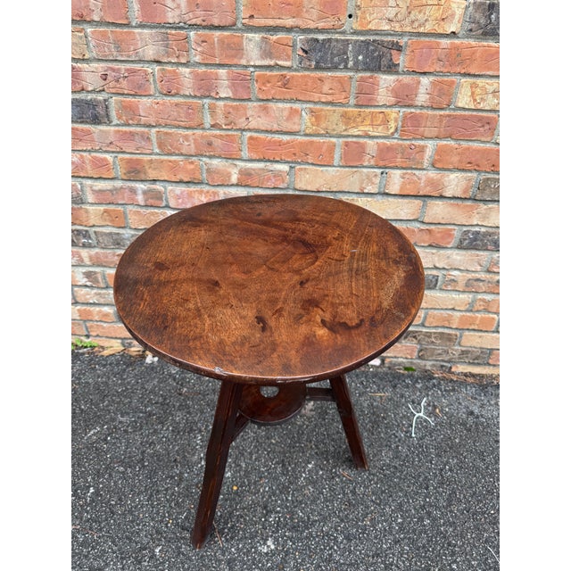 This is an English Cricket table from the late 19th century. The top is walnut with beautiful age and patina, the top has...