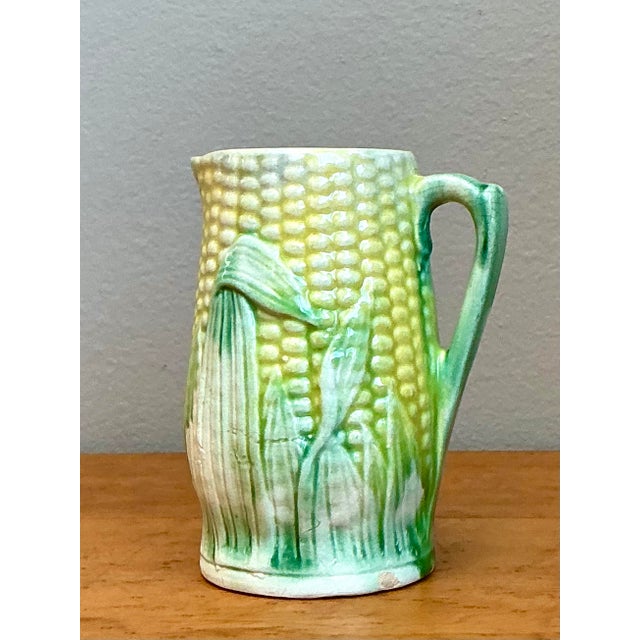 This exquisite German Majolica cream pitcher is a stunning example of late 19th to early 20th-century ceramic artistry....