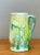 This exquisite German Majolica cream pitcher is a stunning example of late 19th to early 20th-century ceramic artistry....