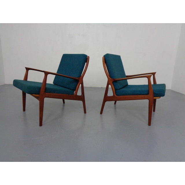 Lightly organic, Danish armchair in teak. Original cushions and covers.