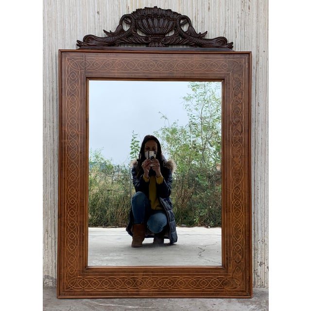 About About This is a beautiful antique Spanish flame mahogany and marquetry wall mirror, circa 1840, 19th century. The...