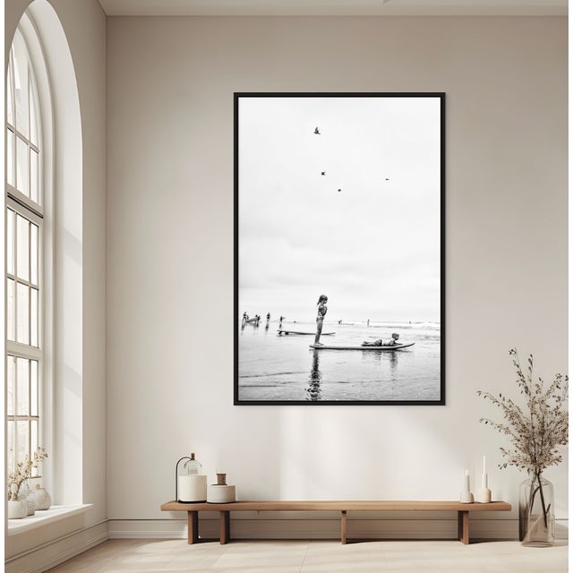 Summer Serenity distills the stillness of childhood by the ocean into a single, weightless moment. Two children balance on...