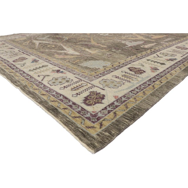 Turkish Oushak rug with Modern Artisan style. The warm colors and subdued geometric print woven into this hand knotted...