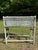 A single antique rectangular woven wicker plant stand with four legs and a metal liner with green painted finish. Insert...