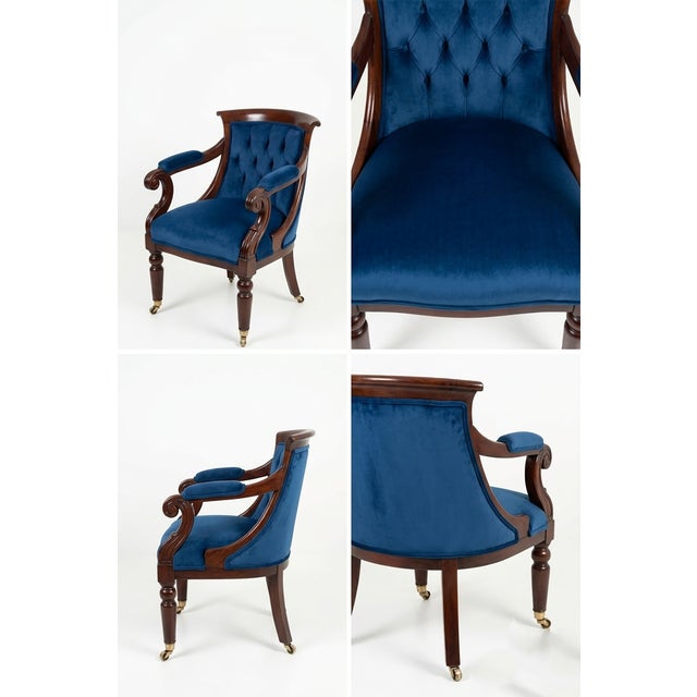 A magnificent Biedermeier armchair, masterfully restored to its original splendor. This piece features a rich, polished...
