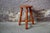 Made entirely of light-colored wood, this rustic stool seems to come straight from a farm or an alpine chalet. Tripod, the...