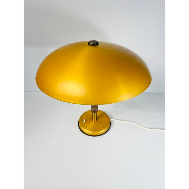 Style & Era This table lamp is a characteristic example of Mid-Century Modern design from the 1950s. Its clean, geometric...