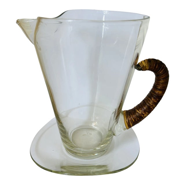 Vintage Carl Aubock Style Pitcher With Rattan Wrapped Handle and Attached Underplate For Sale