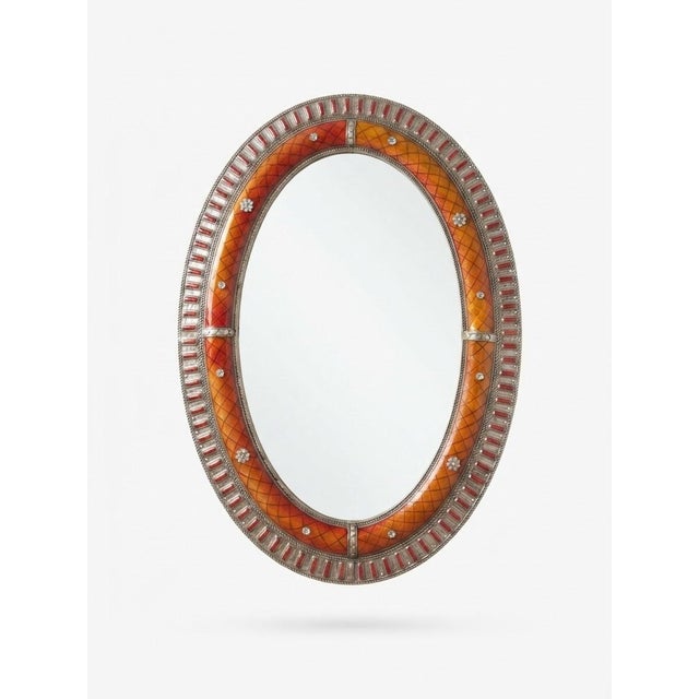This distinctive oval wall mirror is a striking example of contemporary Moroccan craftsmanship. The combination of...