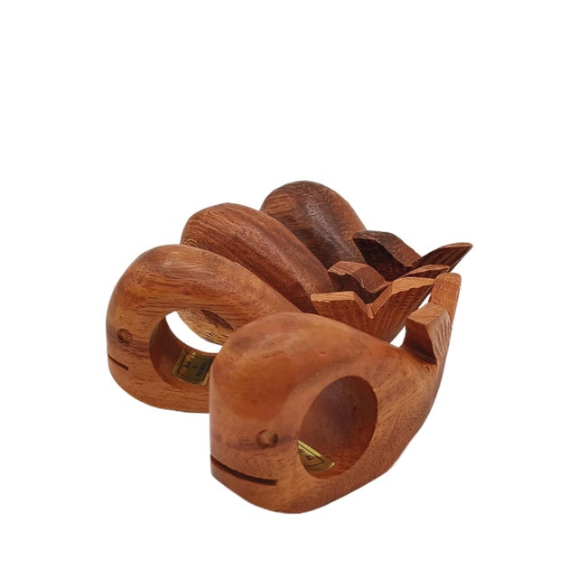 Delightful set of 4 hand carved wooden whale napkin rings reminiscent of mid-century modern style Made in the Philippines...