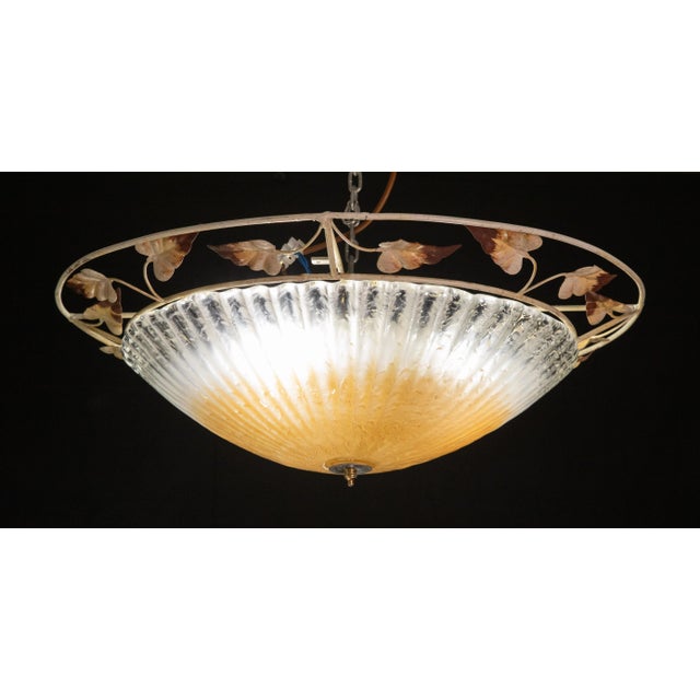 Elegant ceiling lamp with Murano and iron decorated structure. Accommodates tree E27 screw-in bulbs, European standards....