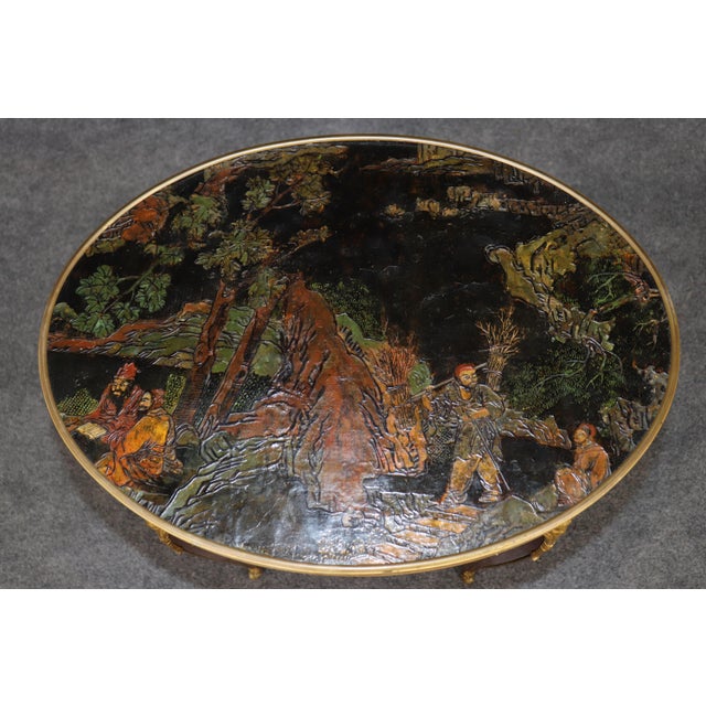 This exceptional French Louis XV style occasional table with its magnificent Coromandel lacquer top, rich mahogany case,...