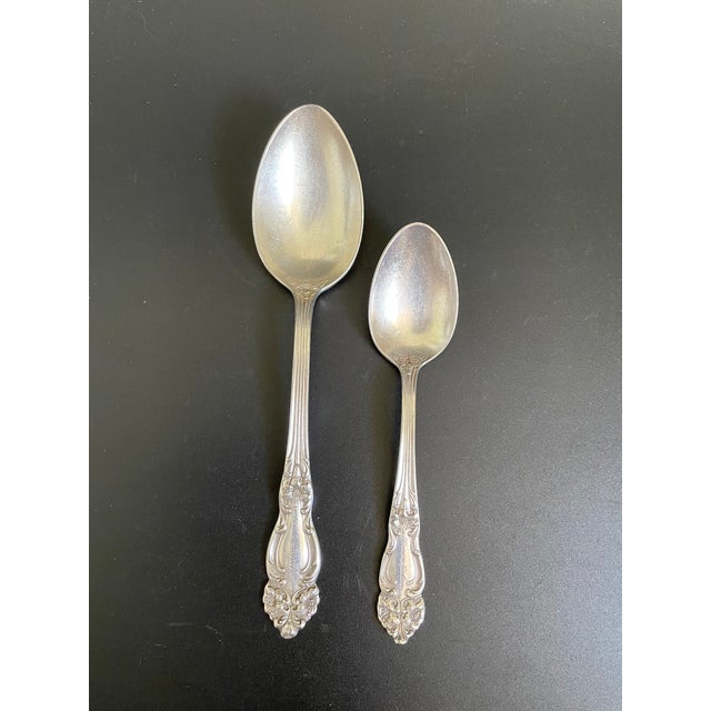 Lot of 2 The Brown Palace Hotel and Spa silverplate spoons by Reed & Barton in the "Tiger Lily" pattern. The lot includes...