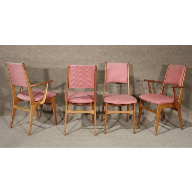 Set of eight dining chairs with teak wood frames. Danish made in the 1960s with simple and handsome design. Two armchairs...
