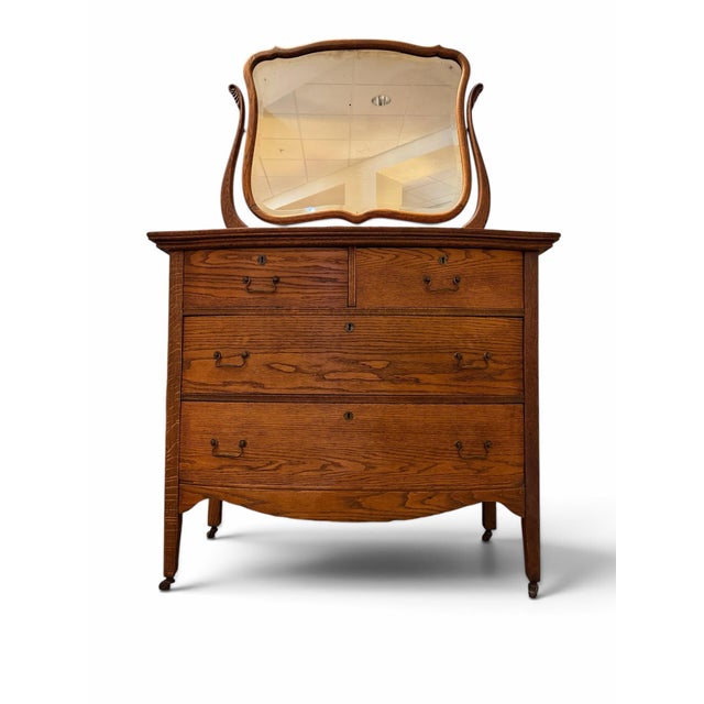 Bring classic Americana elegance into your home with this stunning turn-of-the-century antique dresser. Masterfully...