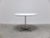 Compact ‘Super-Circular’ dining table designed by Piet Hein & Bruno Mathsson in 1968. This example features a white...