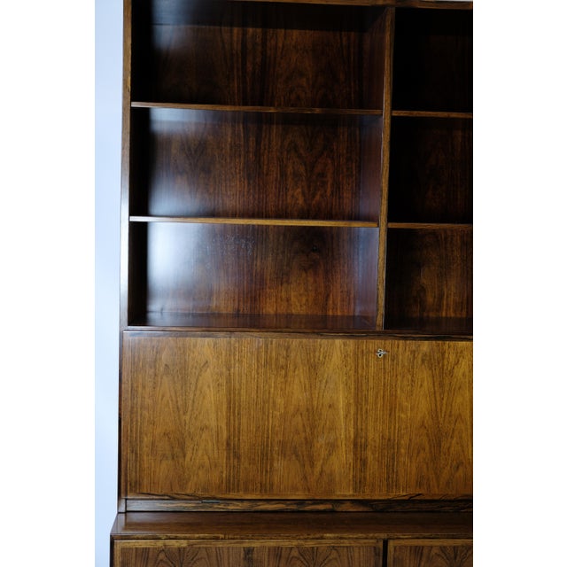 Shelving system with secretary, model 9, designed by omann junior in rosewood of danish design, manufactured at omann...