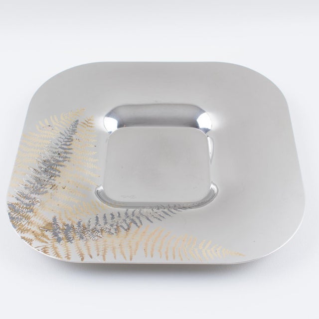 The Italian company Roberto Sambone manufactured this lovely chrome-and-copper centerpiece, serving dish, or bowl for its...