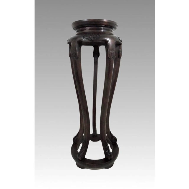 Elegant antique rosewood wood stand or pedestal with simple & decorative hand carved apron and foot embellishments. It has...