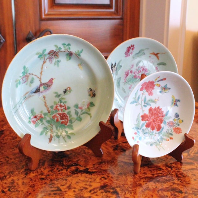 An assembled group of three different designs on celadon porcelain, featuring a bird, butterflies and peonies. A rare...